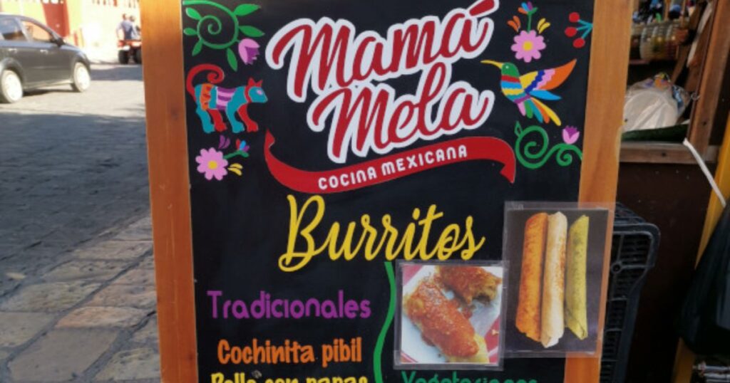 Mama Melas menu and street sign