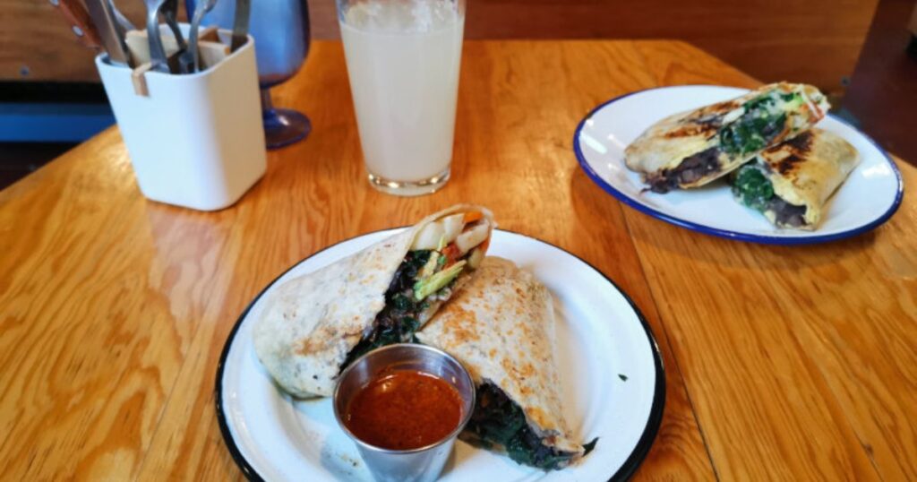 Vegan Gringo burrito with lots of beans, spinach, avocado and veggies